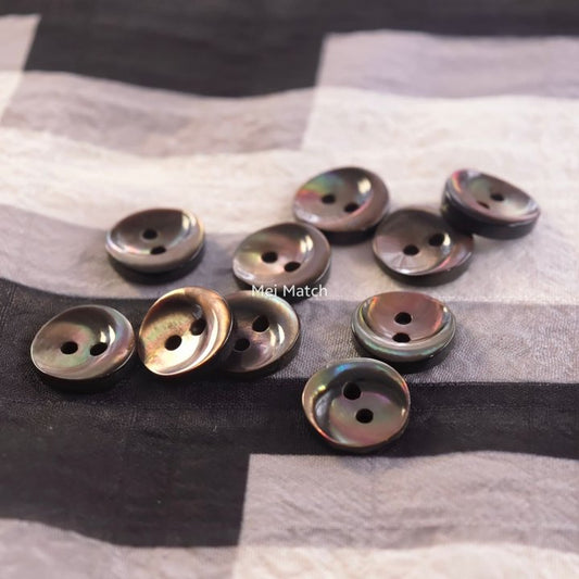 Smoky Black mother of pearl 2 hole shirt buttons with burnt bronze highlights and crescent pattern in 11.5mm Pack of 50